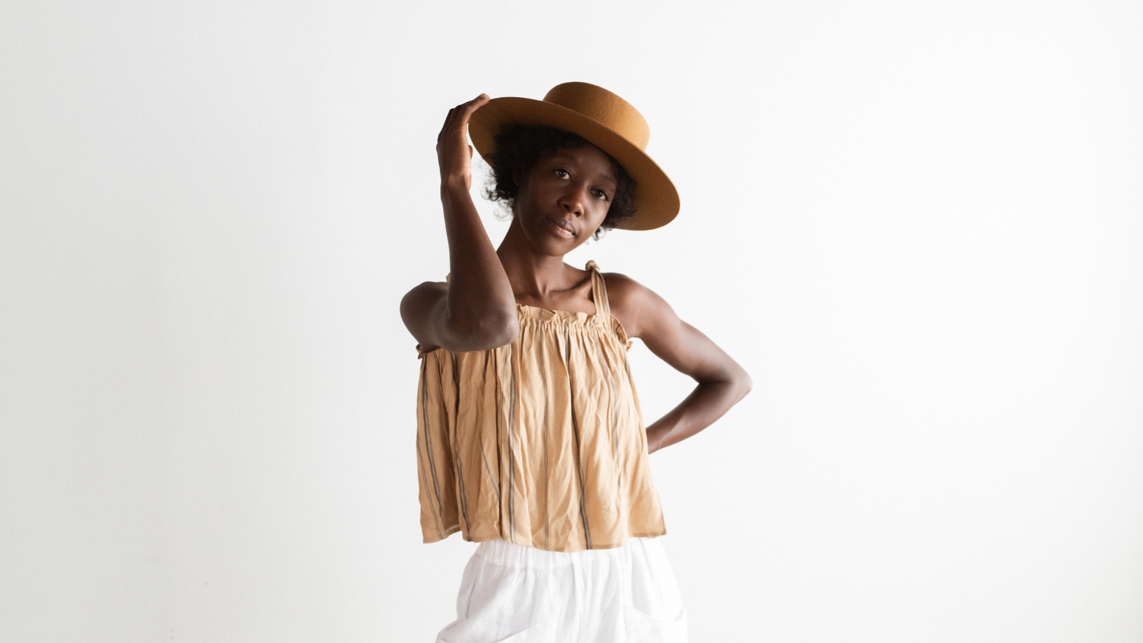 woman short hair wearing a straw hat