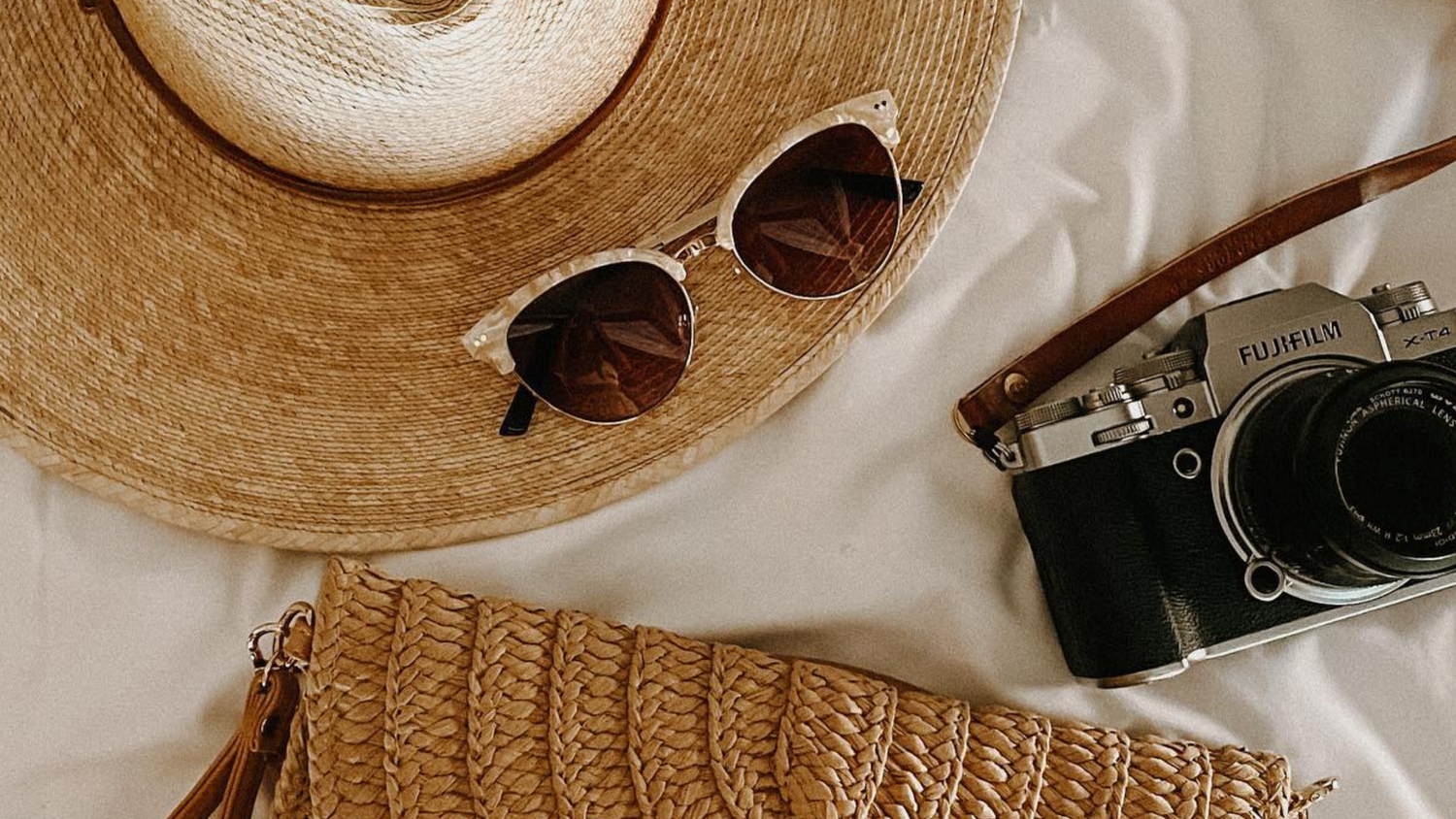 close up of sunglasses hat and camera