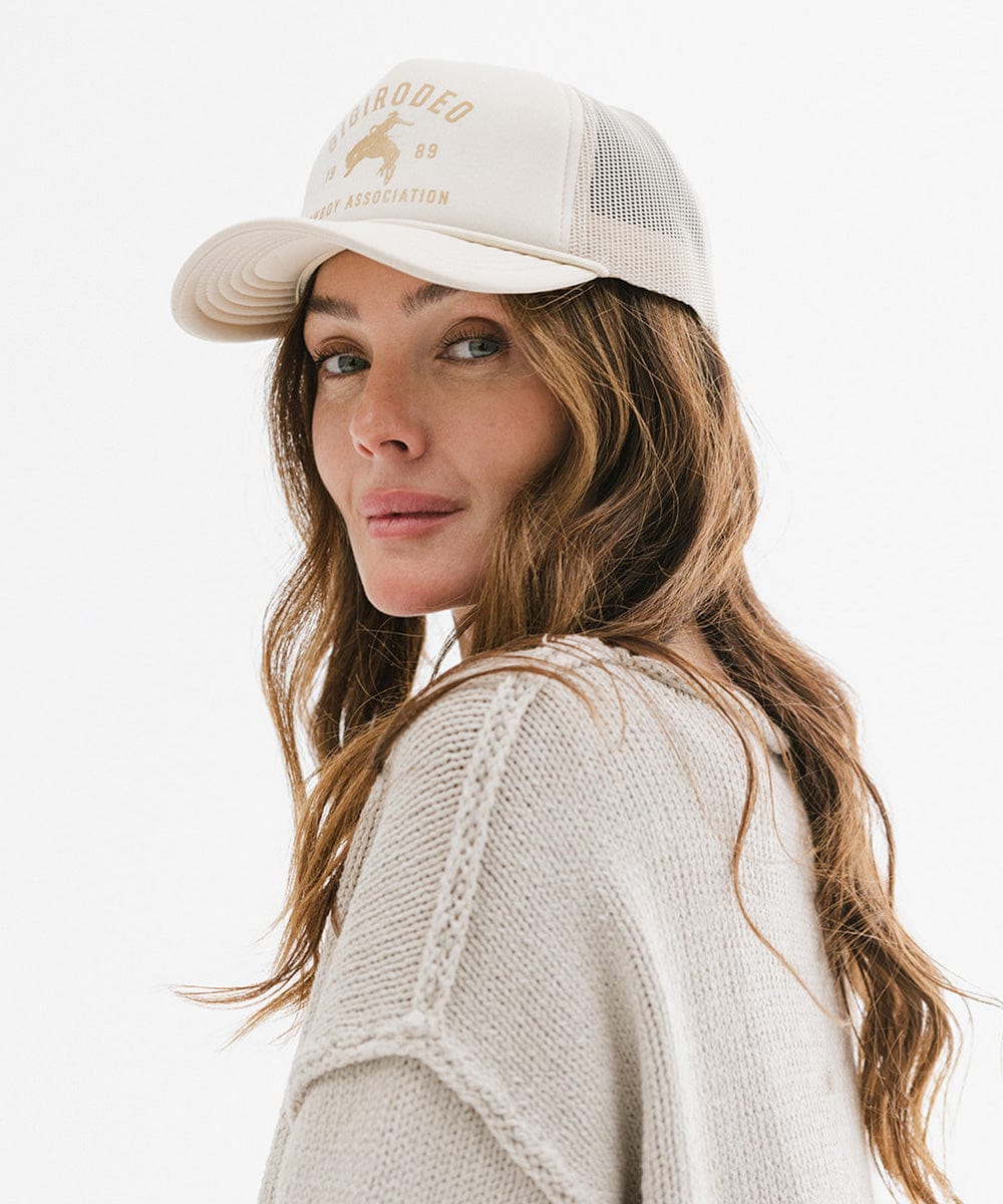 Gigi Pip trucker hats for women - Gigi Rodeo Foam Trucker Hat - 100% polyester foam + mesh trucker hat with a curved brim featuring the words "gigi rodeo" in a contrasting color as a design across the front panel [cream]