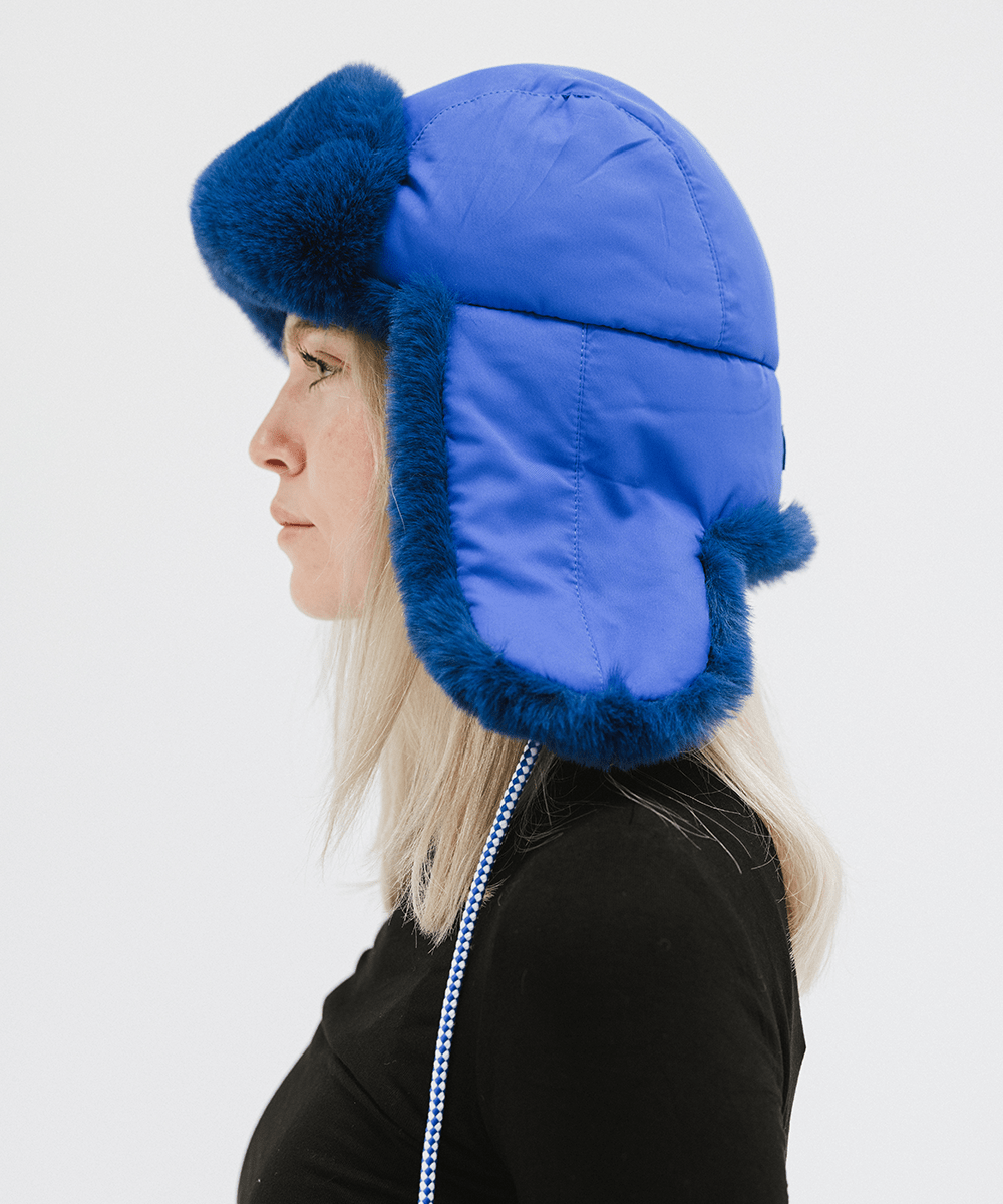 Gigi Pip winter hats for women - Leda Trapper Hat - 100% faux fur + polyester classic style inspired trapper hat featuring a retro limited edition holiday Gigi Pip logo [alpine blue]