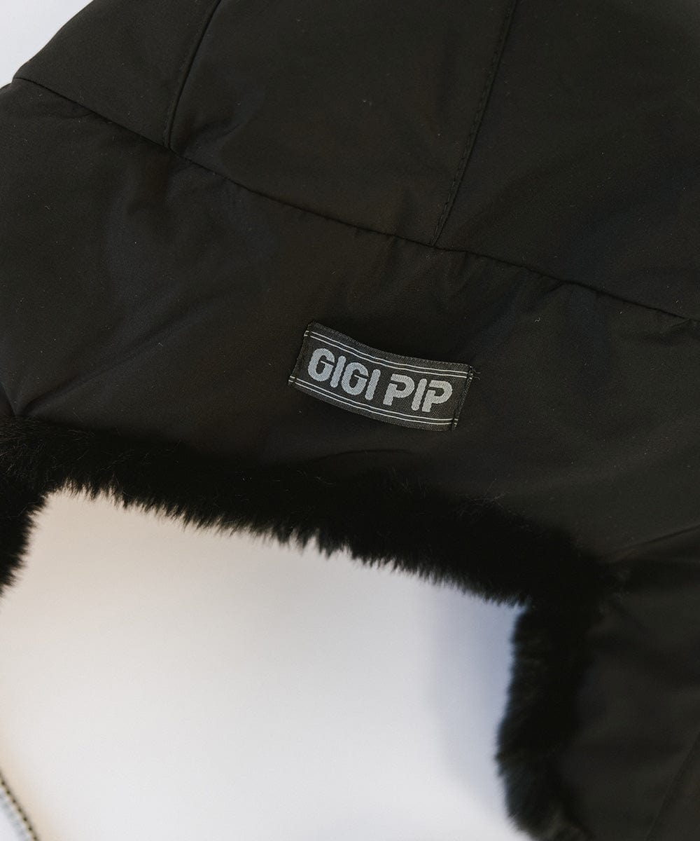 Gigi Pip winter hats for women - Leda Trapper Hat - 100% faux fur + polyester classic style inspired trapper hat featuring a retro limited edition holiday Gigi Pip logo [black]