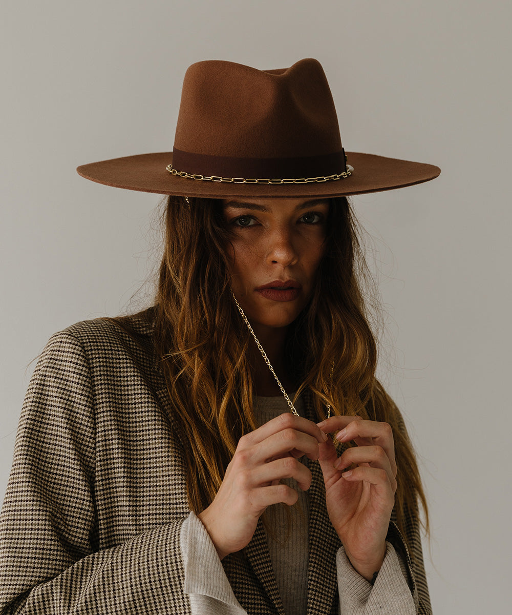 Gigi Pip felt hats for women - Raine Wide Brim Fedora - wide flat brim with a fedora crown, featuring a gold-plated removable paperclip brass chain with three faux pearls and a hand-sewn grosgrain band with the gold Gigi Pip bar around the crown, as well as a removable golden chain chinstrap [dark oak]