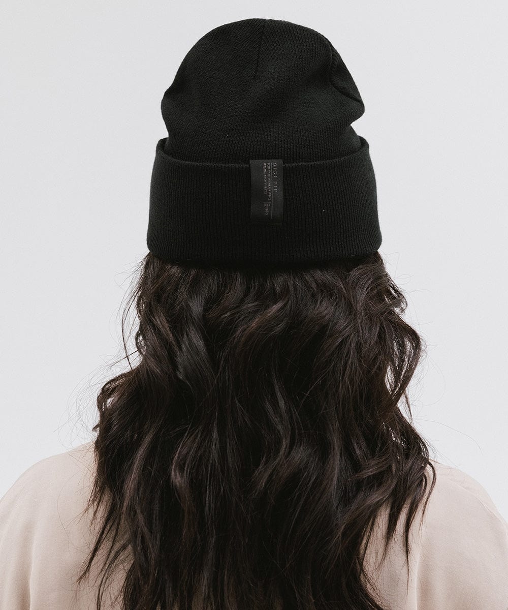 Gigi Pip beanies for women - Shay Beanie - 100% acrylic classic beanie featuring a stylized Gigi Pip loop tag on the fold that says “For the Woman Who Wears Many Hats” [black]