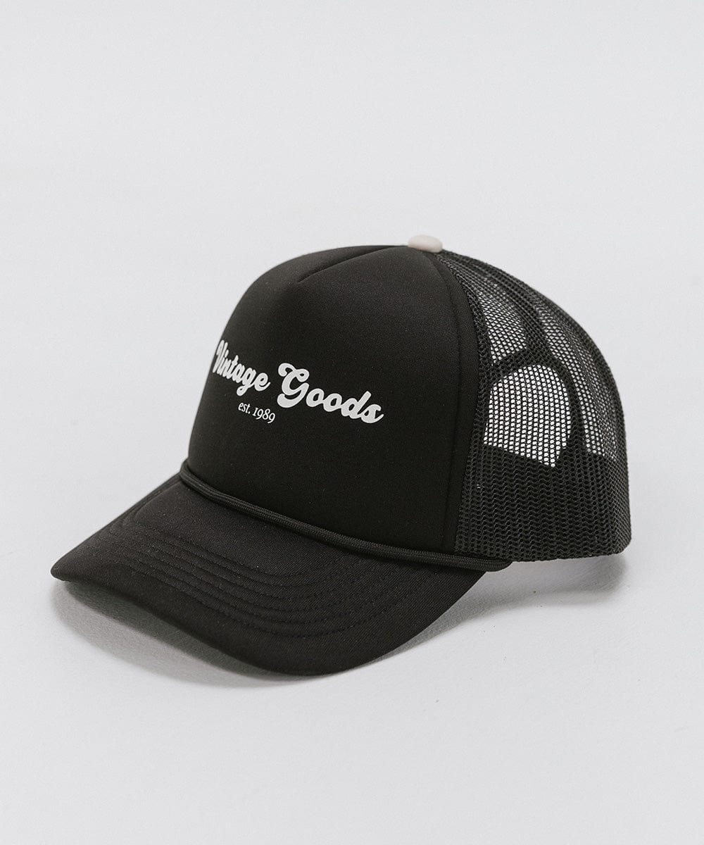 Gigi Pip trucker hats for women - Vintage Goods Foam Trucker Hat - 100% polyester foam + mesh trucker hat with a curved brim featuring the words "vintage goods" in a contrasting color as a design across the front panel [black]