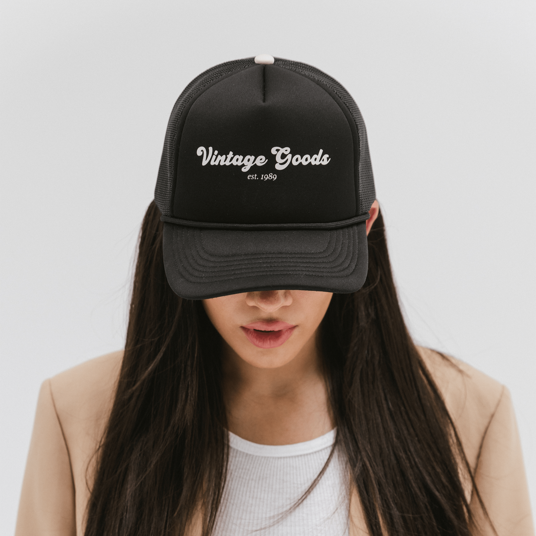 Gigi Pip trucker hats for women - Vintage Goods Foam Trucker Hat - 100% polyester foam + mesh trucker hat with a curved brim featuring the words "vintage goods" in a contrasting color as a design across the front panel [black]